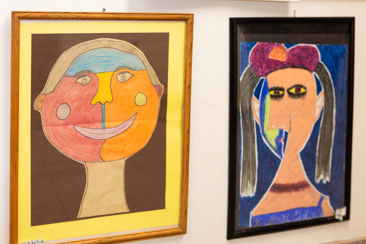Two colorful self-portrait paintings created by Edge High School students